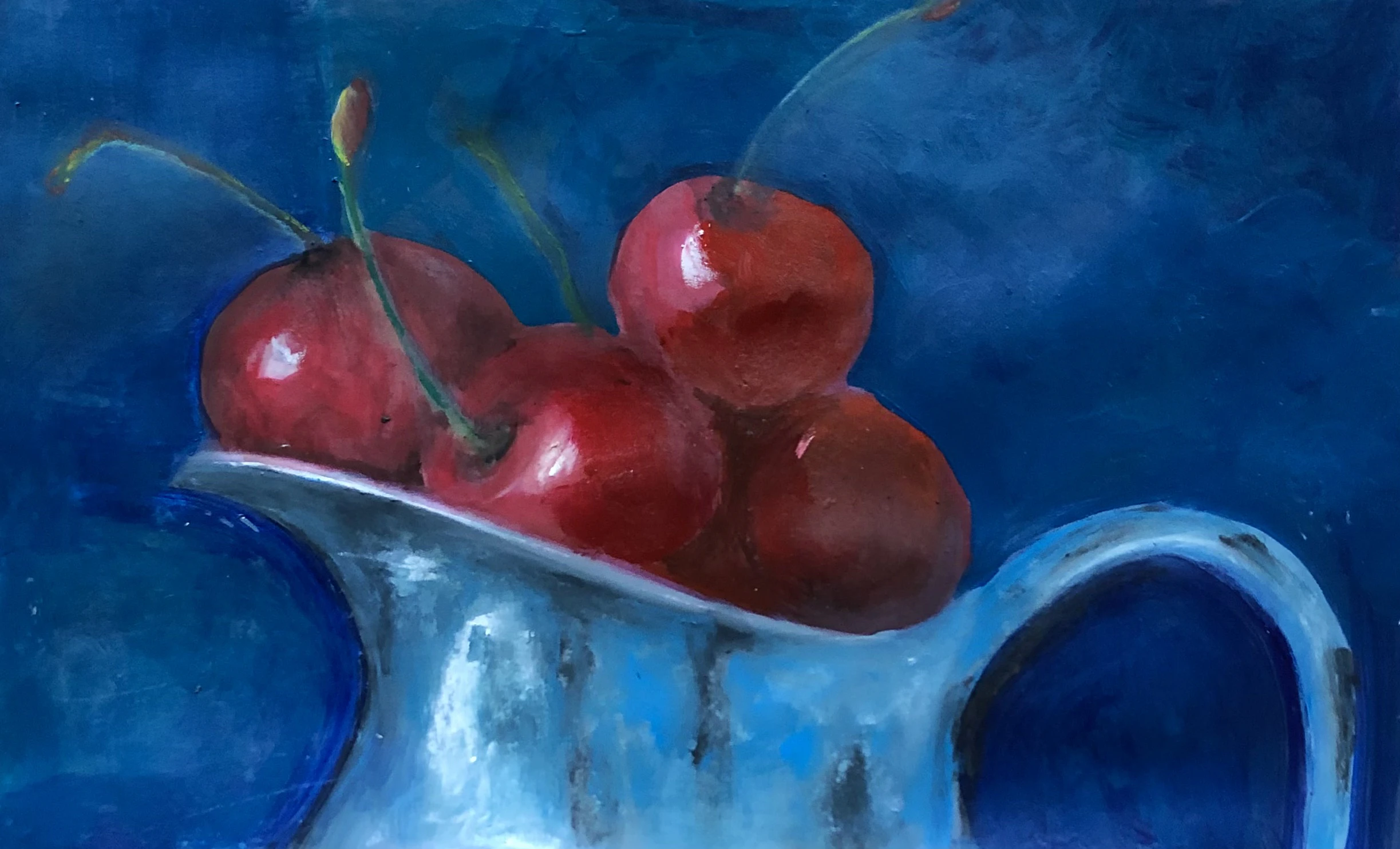 Cherries in an old blue jug