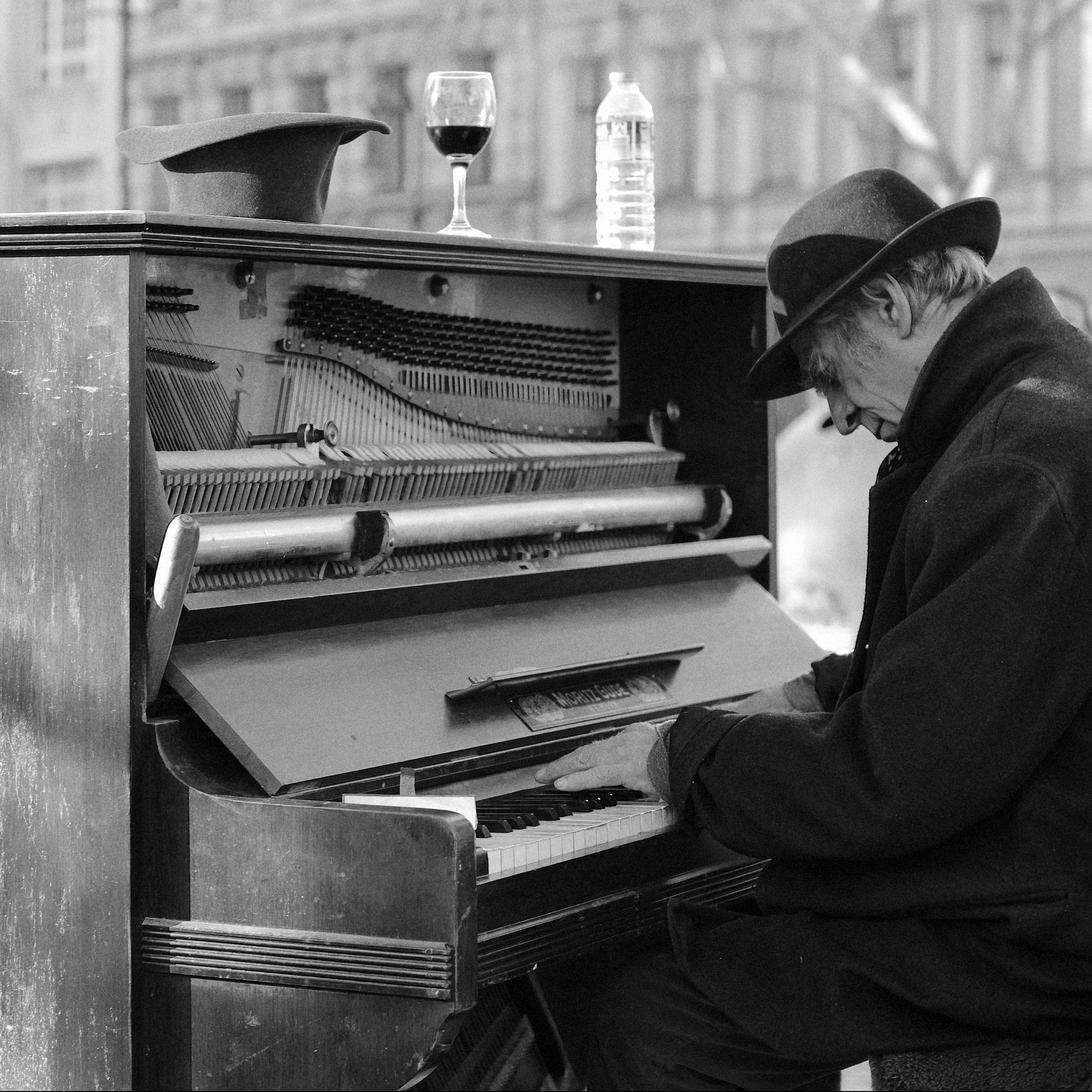 Man busking on a piano